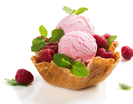 Berry sorbet and fresh raspberries in a wafer bowl isolated on black background Berry sorbet and fresh raspberries in a wafer bowl isolated on black background