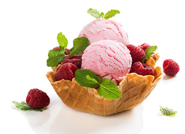 Berry sorbet and fresh raspberries in a wafer bowl isolated on black background Berry sorbet and fresh raspberries in a wafer bowl isolated on black background