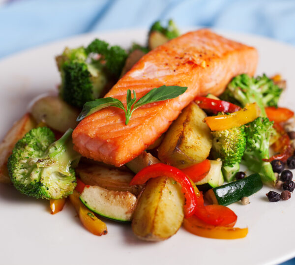 salmon fillet with vegetables and basil salmon fillet with vegetables and basil on a plate